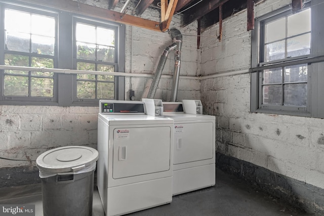 clothes washing area featuring washing machine and clothes dryer