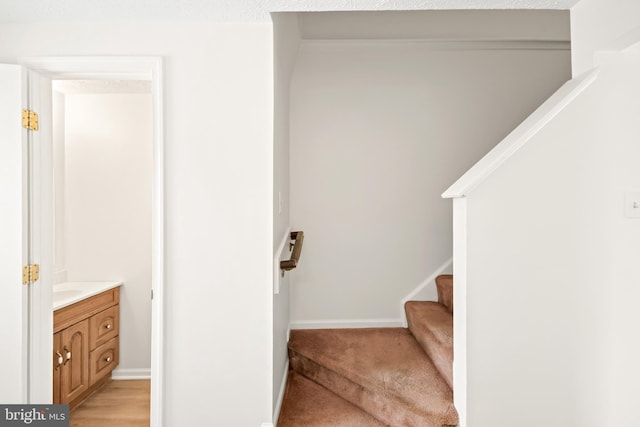 stairs with hardwood / wood-style flooring