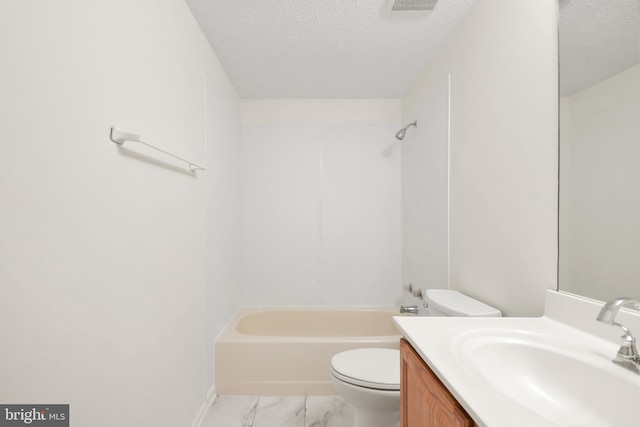 full bathroom featuring vanity, a textured ceiling, shower / bath combination, and toilet