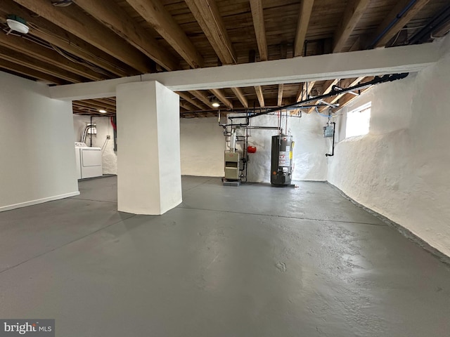 basement with washer / clothes dryer and water heater