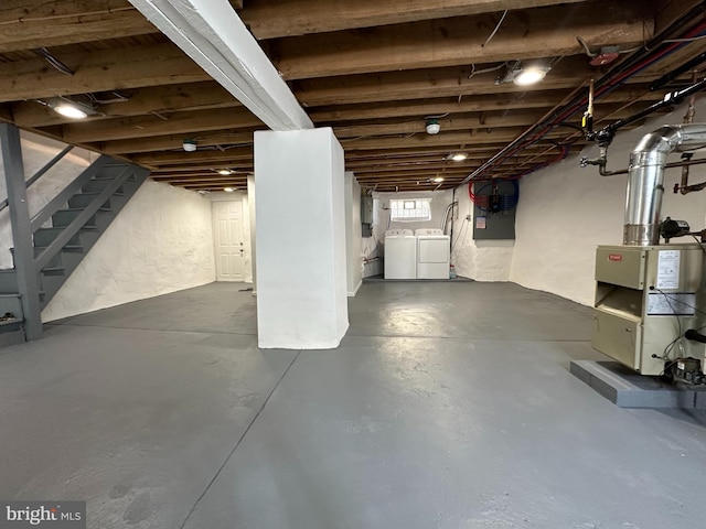 basement with washing machine and clothes dryer