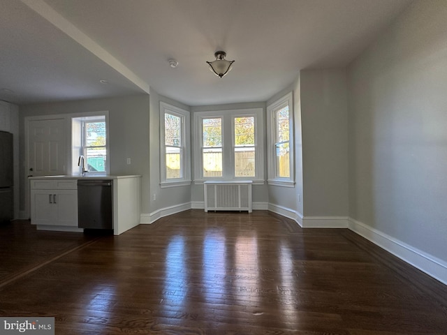 interior space featuring radiator heating unit and dark hardwood / wood-style flooring