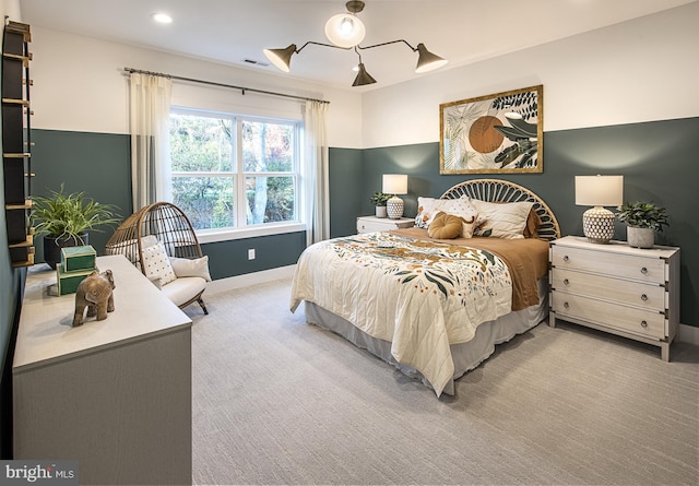 bedroom featuring light colored carpet