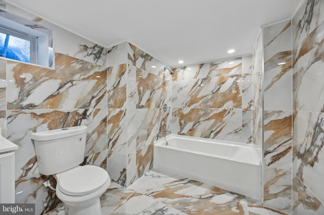 full bathroom featuring toilet, tile walls, washtub / shower combination, and vanity