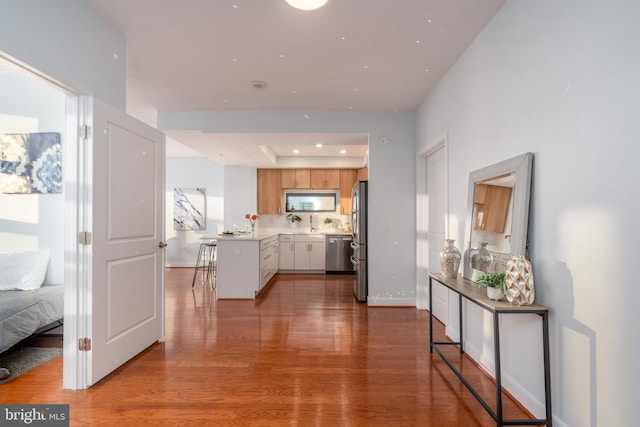 corridor featuring light hardwood / wood-style floors