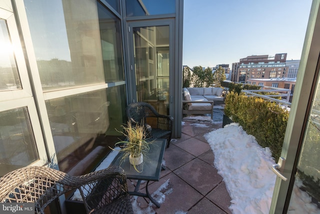 balcony with a patio area and an outdoor hangout area