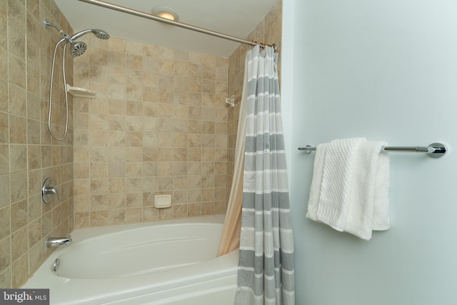 bathroom with shower / bathtub combination with curtain