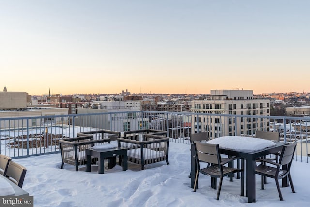 snow covered patio with outdoor lounge area