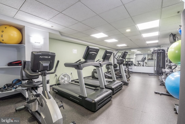 exercise room with a drop ceiling