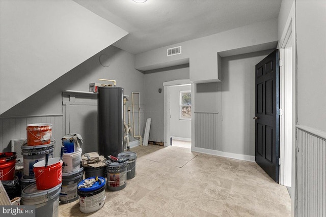 interior space with wainscoting and visible vents