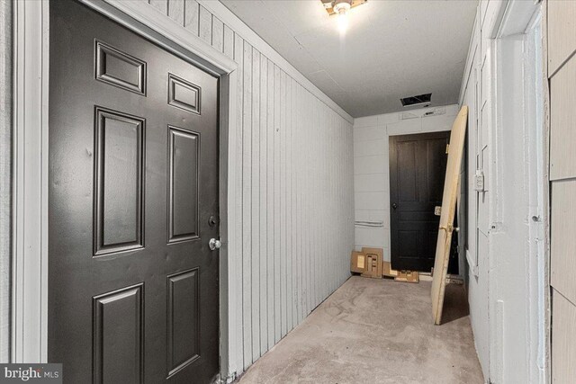 hallway featuring light colored carpet