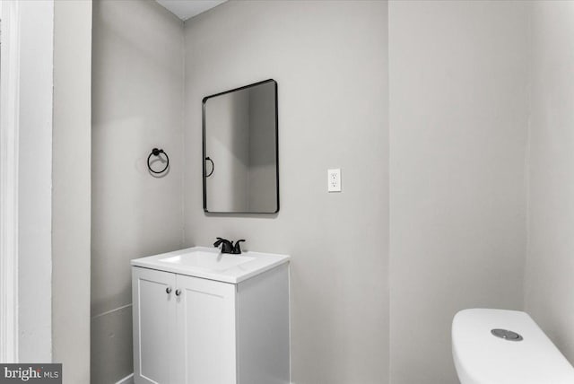 half bath with vanity and toilet