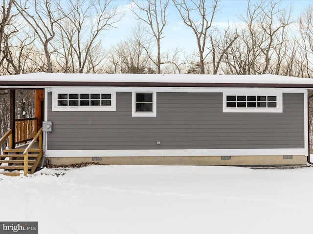 view of snow covered garage