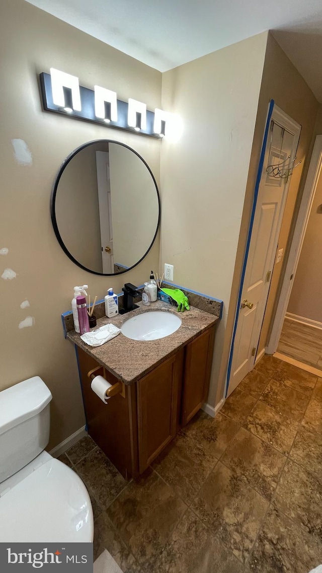 bathroom with vanity and toilet