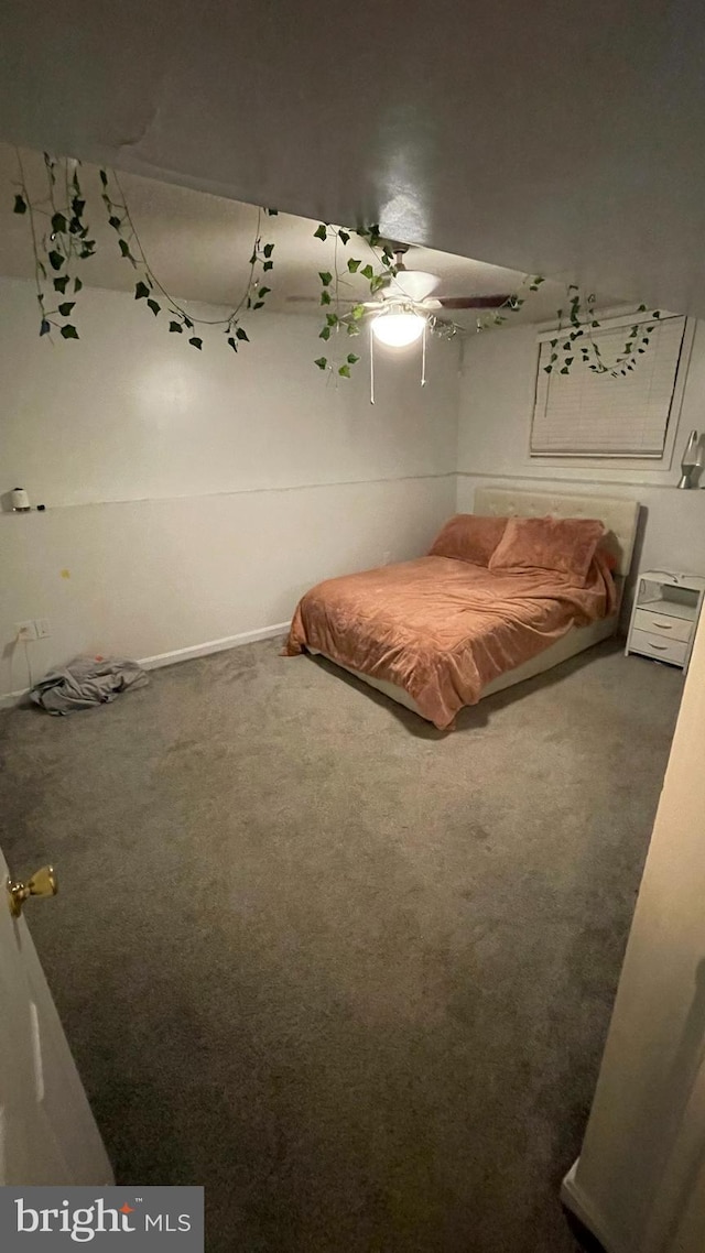 unfurnished bedroom featuring carpet flooring and ceiling fan