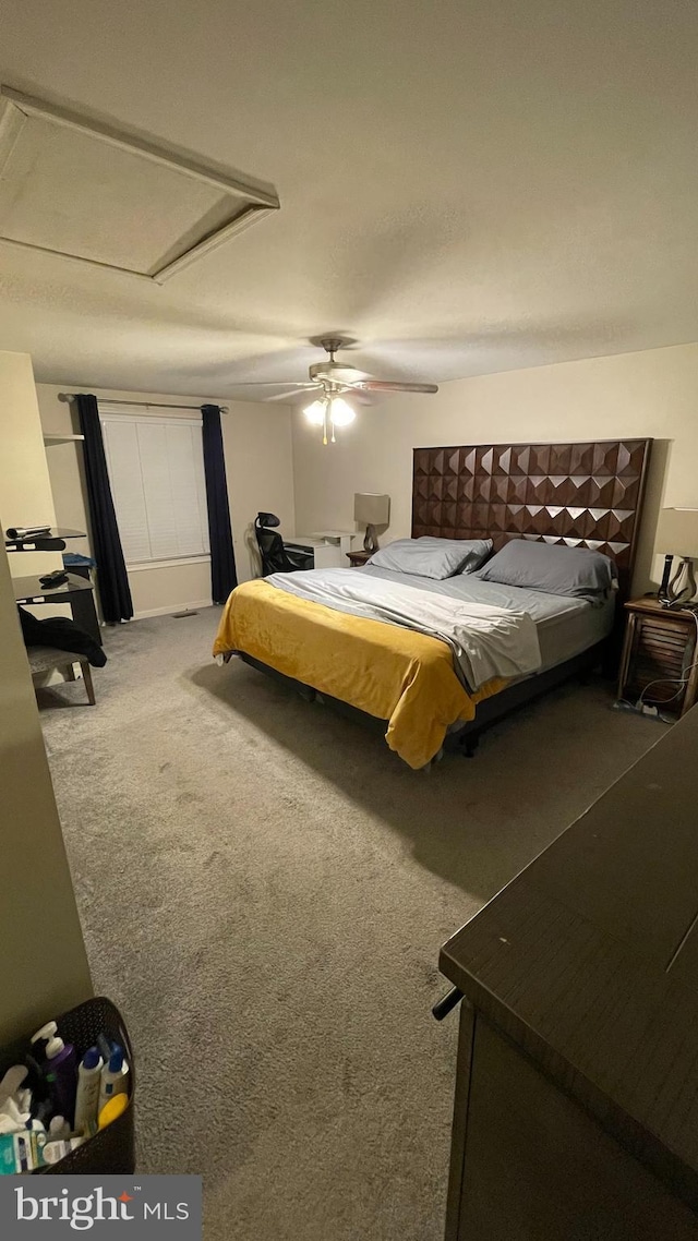 carpeted bedroom with ceiling fan