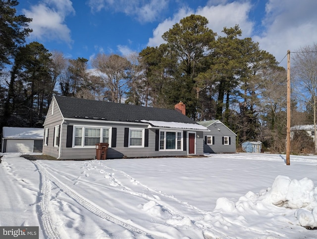 single story home with a storage unit