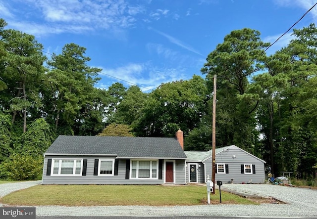 ranch-style house with a front yard