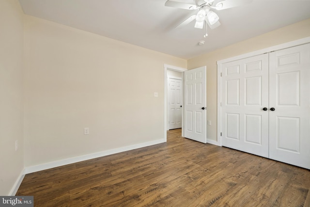 unfurnished bedroom featuring hardwood / wood-style floors, ceiling fan, and a closet