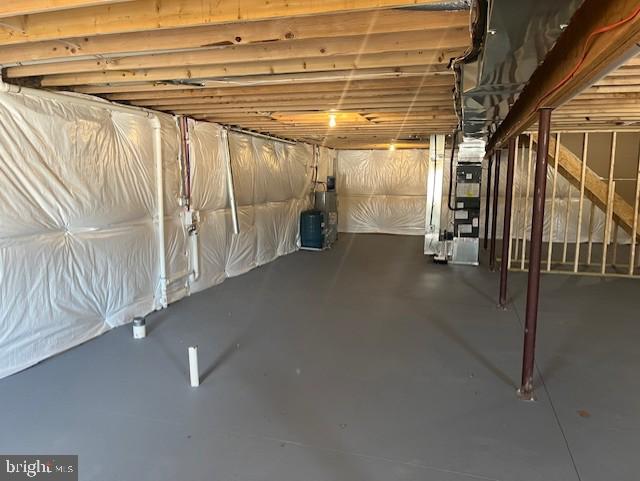 basement featuring heating unit