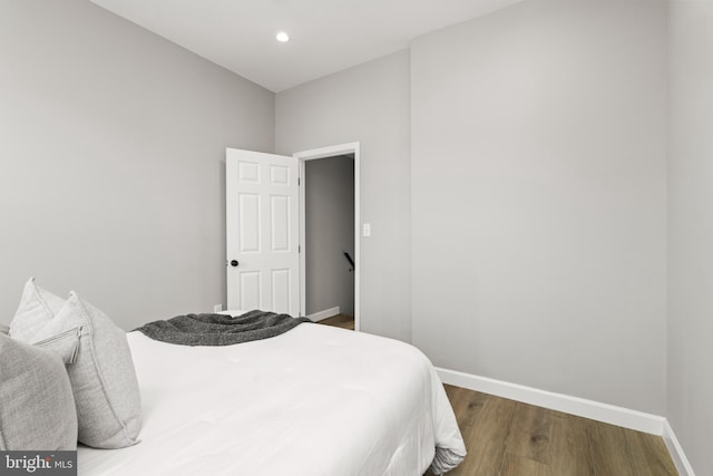 bedroom featuring dark hardwood / wood-style flooring