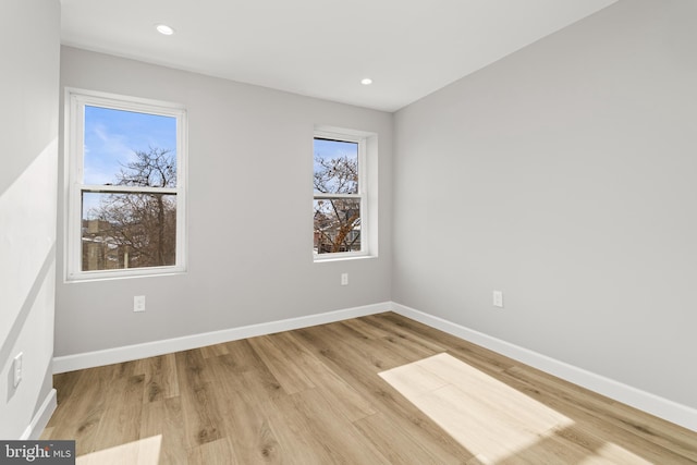 spare room with light wood-type flooring