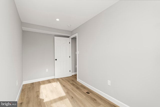 spare room featuring light wood-type flooring