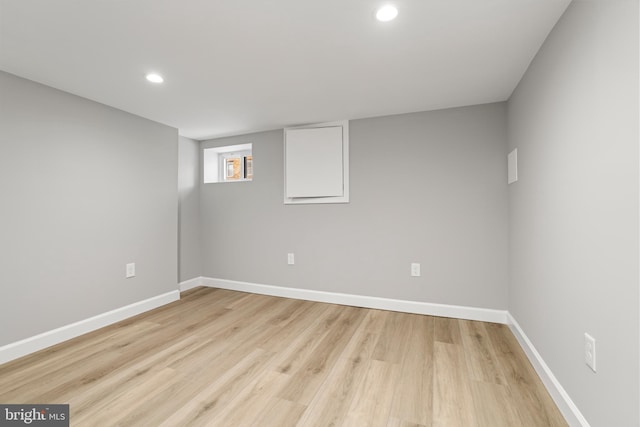 spare room with light wood-type flooring