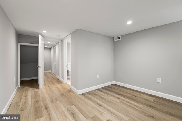 spare room with light hardwood / wood-style floors