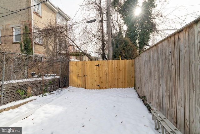 view of yard layered in snow