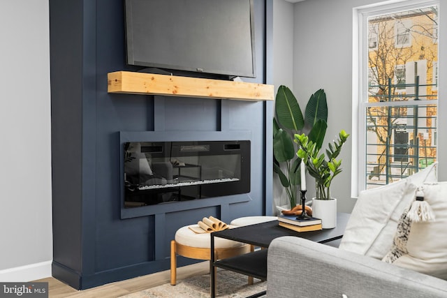 living room featuring plenty of natural light and wood-type flooring