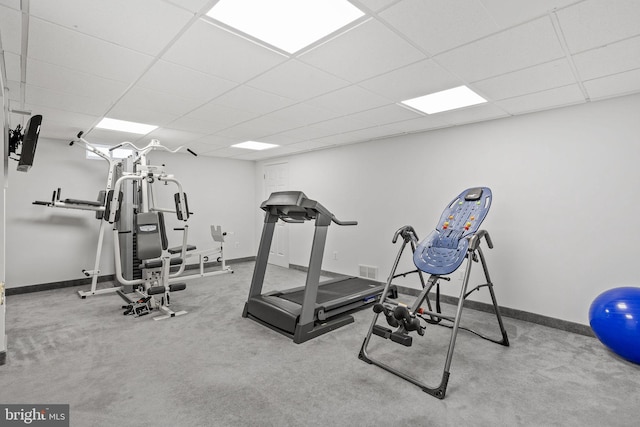 workout room featuring a drop ceiling