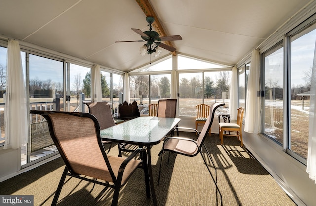 sunroom with vaulted ceiling with beams and ceiling fan