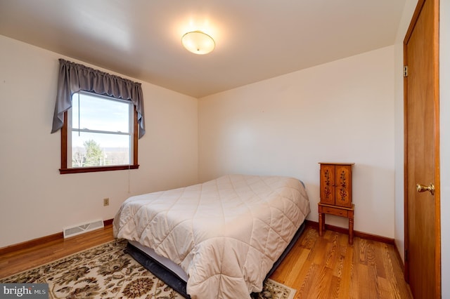 bedroom with light hardwood / wood-style flooring