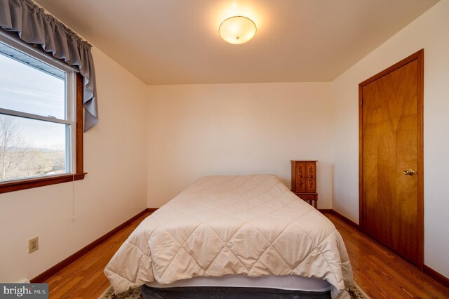 bedroom featuring hardwood / wood-style flooring