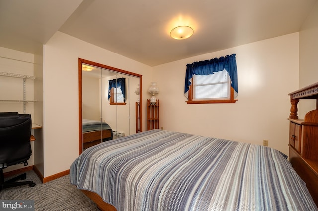 carpeted bedroom with a baseboard radiator and a closet