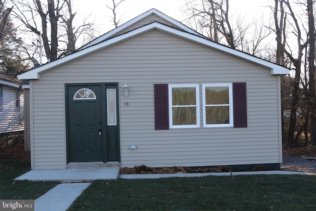 bungalow with a front lawn