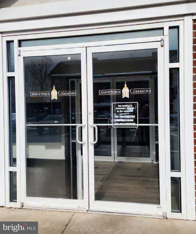 view of exterior entry featuring french doors