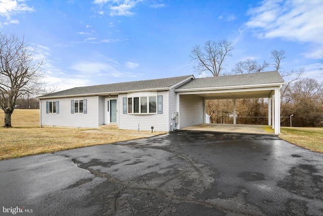 single story home with a carport and a front lawn