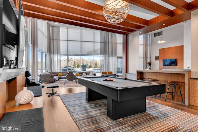 recreation room with expansive windows, a towering ceiling, wood ceiling, and billiards