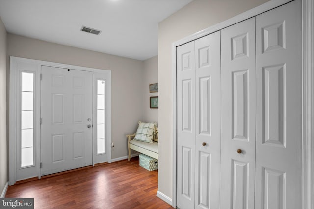 foyer with hardwood / wood-style flooring and plenty of natural light