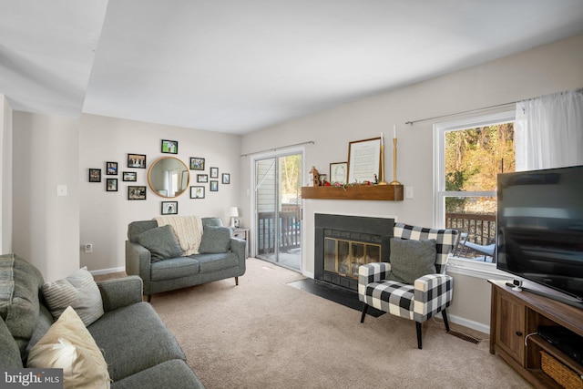 carpeted living room with a wealth of natural light