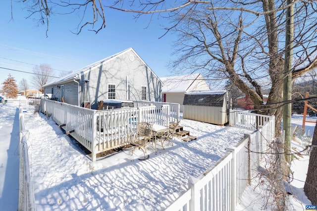 exterior space with a storage unit and a deck