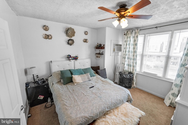 carpeted bedroom featuring multiple windows, a textured ceiling, an AC wall unit, and ceiling fan