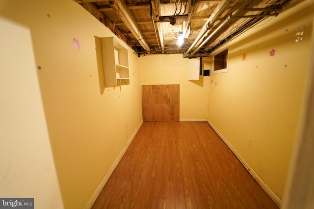 basement with wood-type flooring