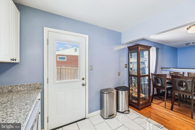 interior space with light hardwood / wood-style flooring