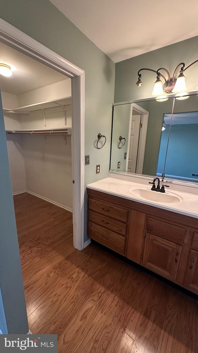 bathroom featuring vanity and hardwood / wood-style flooring