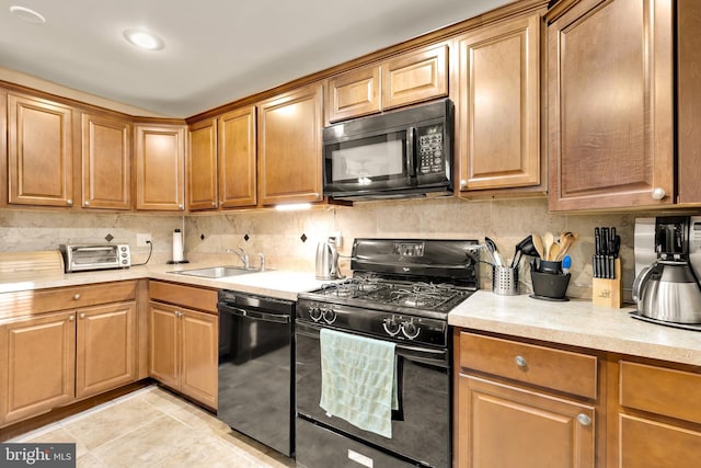 kitchen with black appliances, light tile patterned flooring, sink, and tasteful backsplash