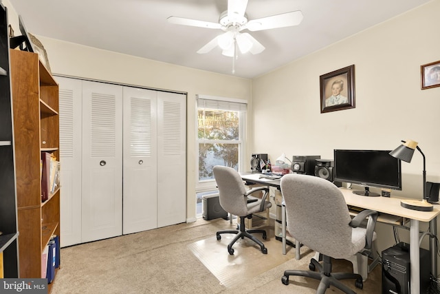 office space with ceiling fan and light colored carpet