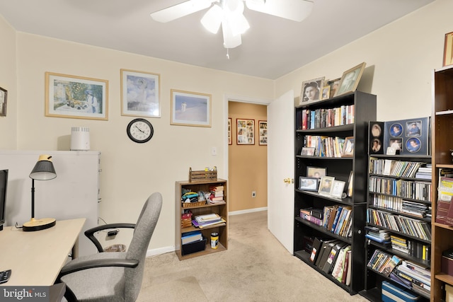 office featuring ceiling fan and light colored carpet